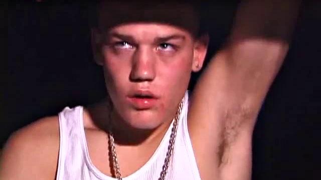 Not content with sitting while he jacks off, Lance teases the neighbors by standing on the roof outside his bedroom window to give everyone a show. Then he finishes by blowing his cum load onto the floor of his bedroom.