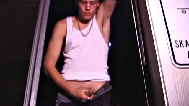 Not content with sitting while he jacks off, Lance teases the neighbors by standing on the roof outside his bedroom window to give everyone a show. Then he finishes by blowing his cum load onto the floor of his bedroom.