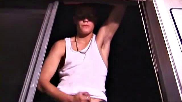 Not content with sitting while he jacks off, Lance teases the neighbors by standing on the roof outside his bedroom window to give everyone a show. Then he finishes by blowing his cum load onto the floor of his bedroom.