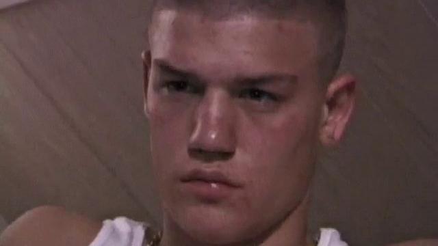 Not content with sitting while he jacks off, Lance teases the neighbors by standing on the roof outside his bedroom window to give everyone a show. Then he finishes by blowing his cum load onto the floor of his bedroom.