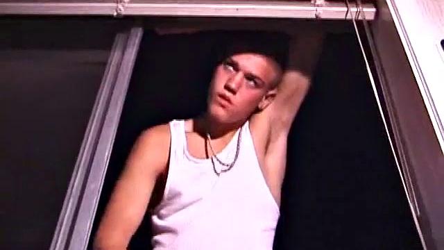 Not content with sitting while he jacks off, Lance teases the neighbors by standing on the roof outside his bedroom window to give everyone a show. Then he finishes by blowing his cum load onto the floor of his bedroom.