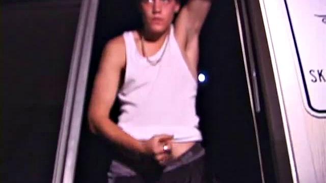 Not content with sitting while he jacks off, Lance teases the neighbors by standing on the roof outside his bedroom window to give everyone a show. Then he finishes by blowing his cum load onto the floor of his bedroom.
