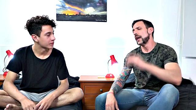 Twink Latino Wilson is on his bed reading when daddy Joris looks for sex. A kiss gets things started and soon the young man is naked and getting his dick sucked.