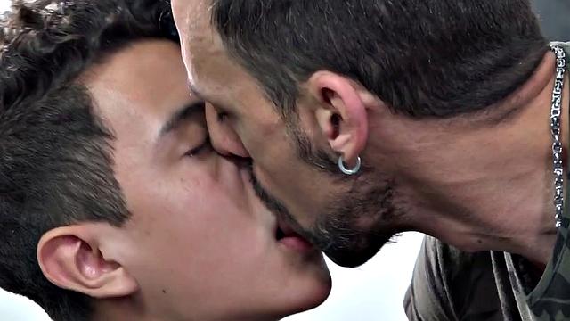 Twink Latino Wilson is on his bed reading when daddy Joris looks for sex. A kiss gets things started and soon the young man is naked and getting his dick sucked.