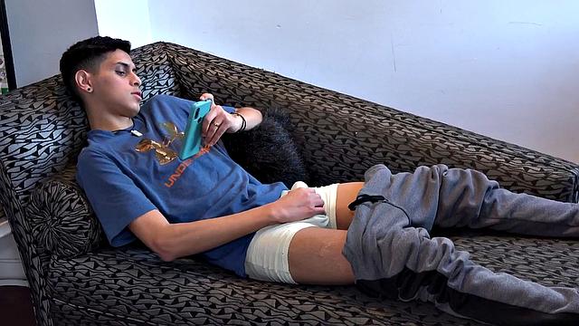 Stretched out on a sofa and watching porn on his phone, Tommy starts working up a stiff one. Once hard, the Latino starts beating off, with eyes glued to the phone.