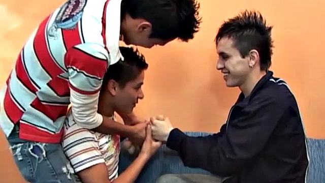 These three horny Latin twinks have fun with a big dildo. Clothes strip off, uncut cock sucked and plastic dick in skinny ass.