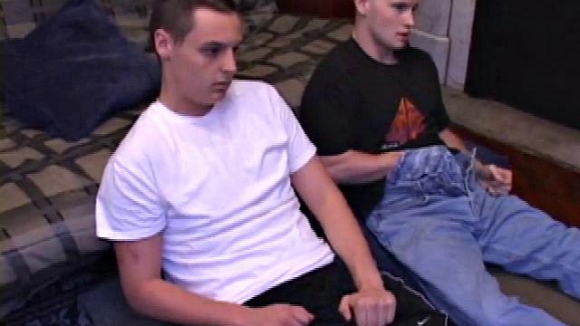 Buddies Lex and Gunner have sent their girls away for the weekend and are eager to spend some time together. The guys sit side-by-side, watching a porn video, and commenting on the show in front of them, while rubbing their growing dicks.