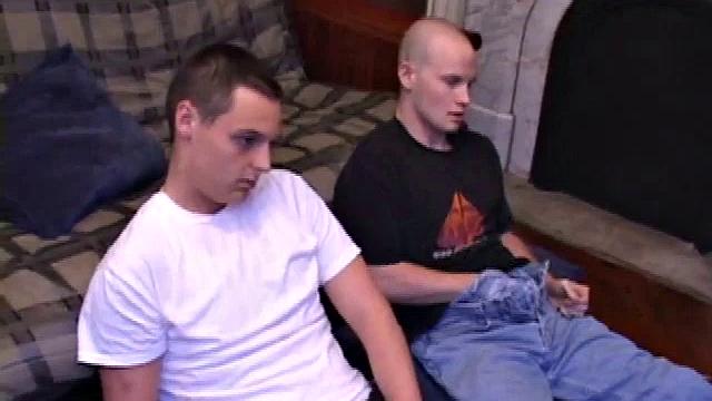 Buddies Lex and Gunner have sent their girls away for the weekend and are eager to spend some time together. The guys sit side-by-side, watching a porn video, and commenting on the show in front of them, while rubbing their growing dicks.