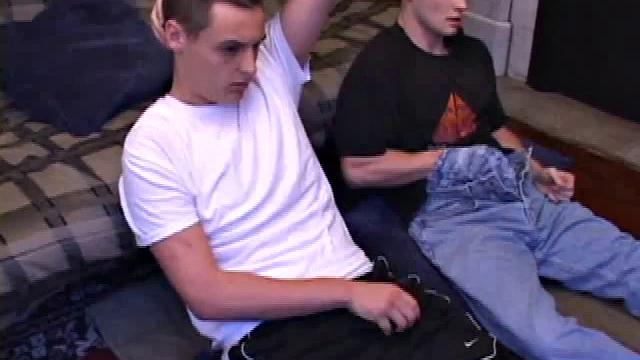 Buddies Lex and Gunner have sent their girls away for the weekend and are eager to spend some time together. The guys sit side-by-side, watching a porn video, and commenting on the show in front of them, while rubbing their growing dicks.